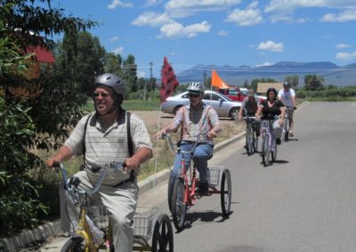 2018 Six Points Group Bike Ride with five bikers on the street in front of their store.