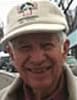 Fred Berry on a winter street wearing a jacket and white winter cap.