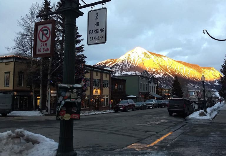 evening light on Crested Butte as the sun is setting as seen from Elk Avenue