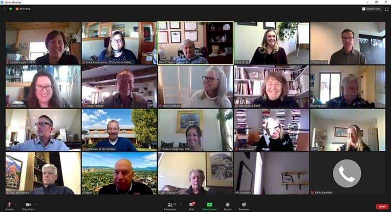 screenshot from a zoom meeting with lots of tiny faces in squares and visible zoom controls